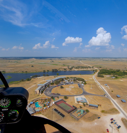 Helicopter landing at Rough Creek Lodge