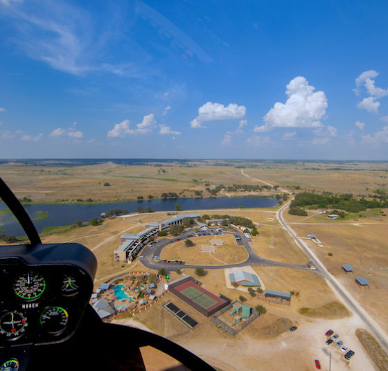 Helicopter landing at Rough Creek Lodge